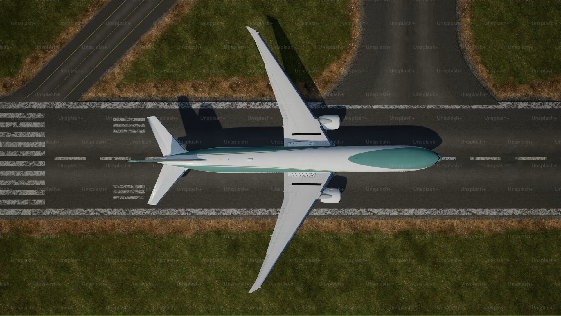 Aerial view of a commercial airplane on a runway, symbolizing challenges faced by a Middle Eastern airline in managing employee travel. TCG Digital's solution integrated SAP's Employee Central, Accelaero for flight tracking, and Active Directory for authentication into a user-friendly ticketing portal for eligibility, policy adherence, booking, and data analysis.